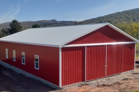 Red and white horse pole barn