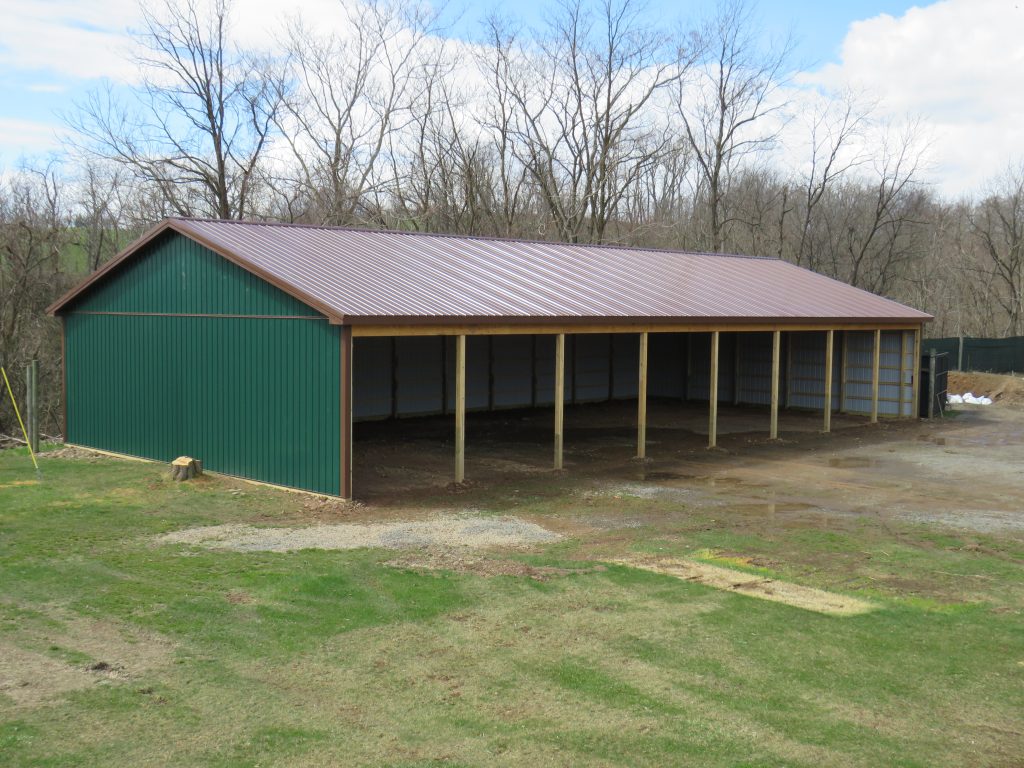 40x80x12 green and brown pole barn